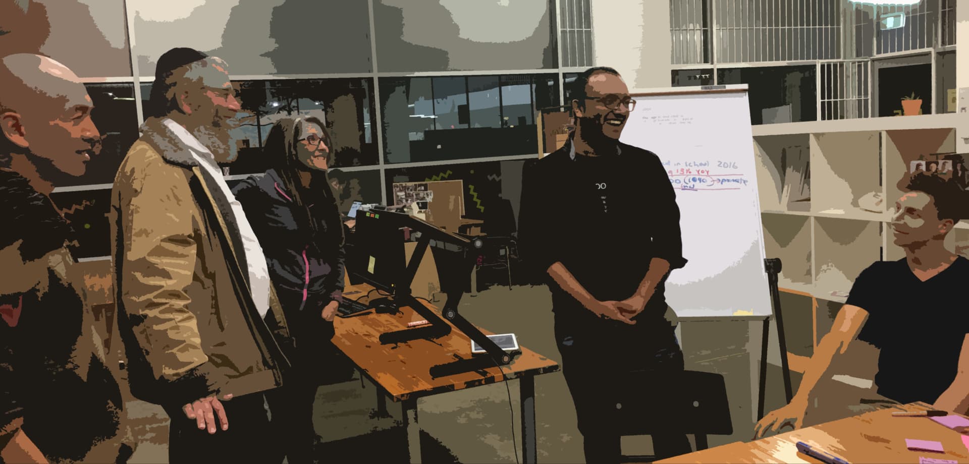 Rabbi Mendel Kastel speaking with the team